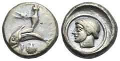 Magna Graecia Calabria. Tarentum. Circa 470-450 BC. Didrachm (Silver, 18.27 mm, 7.59 g). Taras nude on dolphin swimming left, shell below dolphin. Rev. Female head left (the nymph Satyra ?) wearing ta