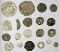 Ancient - Assorted ANCIENT: LOT of 20 coins, including 3 ancient European proto-money (aes rude, ring money, dolphin), 3 Greek silvers (incl. a Halikarnassos hekte and a Gaul quinarius) and 2 bronzes,