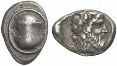 GREEK COINS BOEOTIA No.: 133 Estimate: $ 1000 d=26 mm THEBES. Stater, about 440-380 BC. AR 12.05 g. Boeotian shield decorated with club. Rev. Q-E Bearded head of Dionysus r., crowned with ivy; whole i