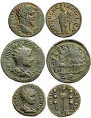 Lot 127.  Lot of Three Antioch in Pisidia Æ's. Includes the following: Septimius Severus. Æ 22mm. Laureate head right / Genius standing left, holding branch and cornucopia. SNG France 1108-14. VF, ear