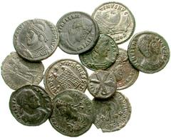Lot 115.  Lot of Twelve Roman Æ's. Includes the following: Licinius. Arles. Emperor on eagle // Constantine I. Follis. Cyzicus mint. Camp gate // Constantius II. Follis. Trier. Camp gate // Constantiu