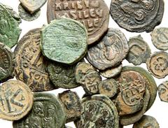 Lot 118.  Lot of Thirty-nine Byzantine Æ's. Lot includes a wide variety of issues including: Anastasius Half Follis // Maurice Tiberius Follis (2) // Maurice Tiberius Half Follis // // Justin II Folli