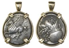 Coin Jewelry Corinth, Corinthia, AR stater, 4th century BC, mounted pegasus-side out in 14K gold bezel. 11.17 grams total. Slightly oval-shaped flan, clear and centered pegasus, bust side also well de