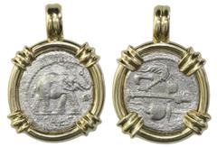Coin Jewelry Roman Republic, AR denarius, Julius Caesar, military mint traveling with Caesar, ca. 49 BC, mounted elephant-side out in 14K gold bezel. 9.01 grams total. Full, choice elephant and nearly