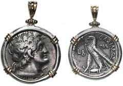 Coin Jewelry Ancient Egypt, AR tetradrachm, Ptolemy IV, ca. 116-106 and 88-80 BC, aligned axis, mounted in heavy silver bezel with 14K gold prongs and shackle bail. 22.83 grams total. Diademed head of
