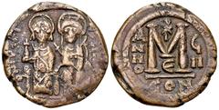 Iustinus II AE Nummus, Constantinople Iustinus II (565-578 AD). AE Nummus (29 mm, 14.66 g), Constantinople, 572-573 AD. Obv. DN IVSTI-NVS PP AVC, Justin II and Sophia seated facing on throne. Rev. Lar