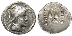 BAKTRIAN KINGDOM. Eukratides, 171-145 BC. AR Obol (0.66 gm). Helemeted draped bust / Caps of the Dioskouri. SNG.ANS.519. Toned aVF.