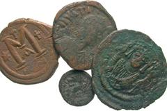 [Byzantine]. Lot of 4 Byzantine Bronze Coins. Justinian, follis / Justinain, decanummium / Justin I, follis / Tiberius II, follis. All are from the Constantinople mint. Average grade: Fine. All group 