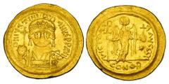 BYZANTINE EMPIRE. Justin I, 518-527 AD. Gold Solidus (4.47 gm) of Constantinople. Helmeted bust 3/4 facing right / Angel standing. S.56. VF+. Scarce.