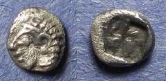 Ionia, Kolophon Circa 500 BC, Tetartemorion, .15g: Obv: Archaic head of Apollo left Rev: Incuse square punch. SNG Kayhan 343.