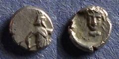 Cilicia, Uncertain 351-338 BC, Tetartemorion, .17g: Obv: king or hero running right with a bow Rev: Female head facing. Troxell & Kagan 2.