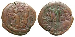 Byzantine Phocas. 602-610. Æ Follis (33.0 mm, 13.54 g). Phocas and Leontia standing. Overstruck on the reverse of a follis minted in Constantinople / Large M, ANNO to left, cross above, II/II to right