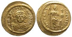 Byzantine BYZANTINE EMPIRE. Justin II, 565-578 AD. Gold Solidus (4.44 gm) of Constantinople. Helmeted bust facing / Constantinopolis seated. S.345. XF.