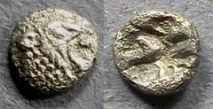 Greek Asia Minor, Uncertain city Circa 450 BC, Tetartemorion, .12g: Obv: Roaring lion head right Rev: Incuse punch. Ref CNG 269/136.