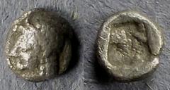 Greek Ionia, Uncertain Circa 550 BC, Tetartemorion, .20g: Obv: Helmeted head of Apollo(?) left Rev: Incuse square punch. SNG Kayhan 343.