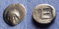 Greek Ionia, Kolophon 450-410 BC, Tetartemorion, .26g: Obv: Facing head of Apollo Rev: "TE" Monogram = tetartemorion. SNG Tubingen 2895.