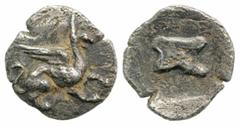 Greek Troas, Assos. Ca. 500-450 B.C. AR tetartemorion (6,4 mm, 0,21 g). Griffin springing right / Astragalos within incuse square. Klein 475. VF. Rare.