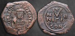 Byzantine Heraclius AD 610-641. Constantinople Follis or 40 Nummi Æ 33 mm, 11,60 g D N hERACLI PERP AVG, helmeted, draped and cuirassed bust facing, holding globus cruciger and shield / Large M, cross