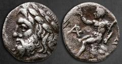 Greek Arkadia. Arcadian League, Megalopolis circa 330-275 BC. Triobol-Hemidrachm AR 15 mm, 2,40 g Laureate head of Zeus left / Pan seated left on rock, holding lagobolon and raising hand; APK monogram