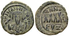 Phocas. AD 602-610. Byzantine Follis AE 30mm., 11,21g. rowned bust facing, wearing consular robes, holding mappa and cross; small cross to left / Large XXXX; date above and to right; KYZA in exergue. 