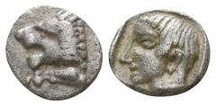 Greek Caria. Knidos circa 490-465 BC. Tetartemorion AR 5mm., 0,23g. Forepart of roaring lion left / Young male head left within incuse square. good very fine SNG Keckman 127.
