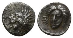 Greek Satraps of Caria. . Hekatomnos 392-377 BC. Tetartemorion AR 6mm., 0,24g. Forepart of a roaring lion left / Head of Apollo facing slightly left. very fine SNG Helsinki 848 (as uncertain).