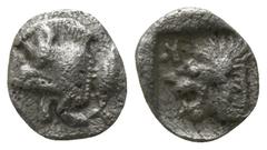 Greek Mysia. Kyzikos circa 480 BC. Tetartemorion AR 5mm., 0,17g. Forepart of boar left with tall mane and dotted truncation; to right, tunny upward / Head of roaring lion left with bristling mane, out