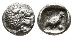 Greek Ionia. Miletos circa 525-500 BC. Tetartemorion AR 4mm., 0,23g. Forepart of lion left, head looking backwards, with open jaws and tongue protruding / Bird standing right between two pellets diago
