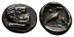 Greek Ionia. Miletos circa 525-500 BC. Tetartemorion AR 5mm., 0,29g. Forepart of lion left, head looking backwards, with open jaws and tongue protruding / Bird standing right between two pellets diago