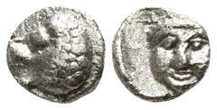 Greek Satraps of Caria. Hekatomnos 392-377 BC. Tetartemorion AR 4mm., 0,20g. Forepart of a roaring lion left / Head of Apollo facing slightly left. very fine