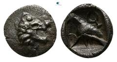 Greek Western Asia Minor. Uncertain mint, possibly Mylasa in Caria circa 500-400 BC. Tetartemorion AR 4mm., 0,16g. Head of lion right / Bird standing left, crescent to left, monogram to right, all wit