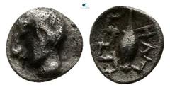 Greek Ionia. Magnesia ad Maeander circa 450-400 BC. Tetartemorion AR 6mm., 0,13g. Head of Apollo left / Grain of corn, ΓNH right, maeander pattern left. very fine SNG Kayhan 395-6 var.