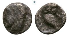 Greek Asia Minor. Uncertain mint circa 500-400 BC. Tetartemorion AR 3mm., 0,15g. Head of Apollo (?) left / Owl standing left, head facing, unknown symbol to right, within incuse square. nearly very fi