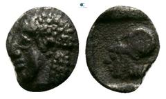 Greek Mysia. Lampsakos circa 500-450 BC. Hemitetartemorion AR 4mm., 0,11g. Head possibly of Apollo left / Head of Athena left, wearing Corinthian helmet. very fine Asia Minor Coins, #11208 (Tetartemor
