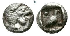 Greek Ionia. Miletos 525-500 BC. Tetartemorion AR 4mm., 0,32g. Forepart of lion left, head looking backwards, with open jaws and tongue protruding / Bird standing right between two pellets diagonally 