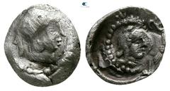Greek Dynasts of Lycia. Kherei 410-390 BC. Hemiobol AR 7mm., 0,28g. Head of Athena left, wearing crested Attic helmet / Bearded head of dynast right, wearing kyrbasia. nearly very fine, overstruck Tra