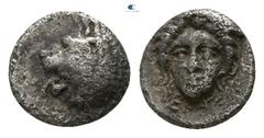 Greek Satraps of Caria. Mylasa. Hekatomnos 392-377 BC. Tetartemorion AR 4mm., 0,21g. Head of roaring lion left / EKA, head of Apollo facing slightly left. very fine Klein 507.