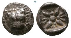 Greek Asia Minor. Uncertain mint or Miletos circa 450-350 BC. Tetartemorion AR 6mm., 0,28g. Facing head of lioness within frame of pearls / Floral pattern. very fine Isegrim -; SNG von Aulock -; SNG C