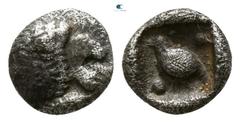 Greek Ionia. Miletos 525-500 BC. Tetartemorion AR 4mm., 0,23g. Forepart of lion right, head looking backwards, with open jaws and tongue protruding / Bird standing right between two pellets diagonally