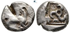 Greek Dynasts of Lycia. Kuprilli circa 470-435 BC. Stater AR 18 mm., 8,66 g. Goat kneeling right, head reverted / Triskeles, retrograde K-[O]-Π around, all in dotted square within incuse square. nearl