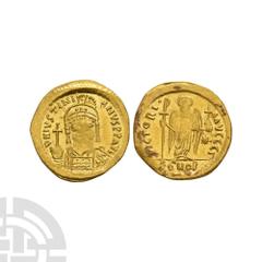 Coins - Byzantine Justinian I - Victory Gold Solidus. 527-565 A.D. Constantinople mint. Obv: D N IVSTINIANVS P P AVG legend with helmetted and cuirassed bust facing holding globus cruciger and shield.