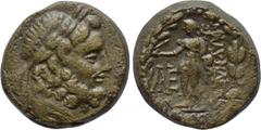 LYDIA. Blaundos. Ae (2nd-1st centuries BC).. Obv: Laureate head of Zeus right.. Rev: MΛAYNΔEωN. Hermes standing left, holding purse and kerykeion; monogram to left; all within wreath. SNG Copenhagen 6