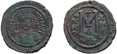 Byzantine Justinian I. Follis; Justinian I; 527-565 AD. Nicomedia, Year 13 = 539/40 AD, Follis, 22.73g. Berk-228, DO-117. Obv: D N IVSTINI - ANVS PP AVG Helmeted, cuirassed bust facing, holding cross 
