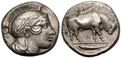 MAGNA GRAECIA. LUCANIA, THOURIOI. Silver didrachm, circa 443-400 BC. Obv: head of Athena right, wearing crested Attic helmet decorated with laurel wreath. Rev: ΘΟΥΡΙΩΝ, bull butting right; Δ below; fi