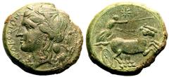 MAGNA GRAECIA. SICILY, SYRACUSE. temp. Hiketas II. Bronze ae25, circa 287-278 BC. Obv: ΣYPAKOΣIΩN, head of Kore left, wearing laurel wreath; grain ear behind. Rev: Nike driving galloping biga right; s