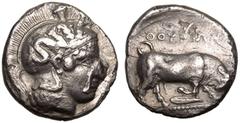 MAGNA GRAECIA. LUCANIA, THOURIOI. Silver Nomos, circa 400-350 BC. Obv: head of Athena right, wearing crested Attic helmet decorated with Skylla. Rev: bull butting right, ΘOYPIΩN above; olive leaf belo