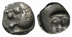 A selection of fractions and Arabian coins Satraps of Caria, Hekatomnos, c. 392/1-377/6 BC, Tetartemorion, 0.20g, 5mm. Forepart of a roaring lion left / Laureate head of Apollo facing slightly left. C