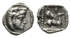 The D.S. Collection of Cyprus Cyprus, Kition, Uncertain King, 4th-3rd century BC, Hemiobol, 0.24g, 7mm. Head of Herakles in lion's skin right / Stag kneeling right attacked by lion on its back. BMC 57