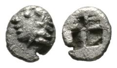 Greek Ionia, Kolophon, late 6th century BC, Tetartemorion, 0.15g, 4mm. Archaic head left / Incuse square punch. SNG Kayhan 343-7; SNG von Aulock 1810. Good Very fine, light porosity.