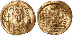 Ancient Coins, Byzantine Empire, Justinian I (AD 527-565), solidus, Constantinople mint, D N IVSTINIANVS PP AVG, helmeted and cuir. bust facing, holding globus cruciger and shield, rev. VICTORIA AVGGG